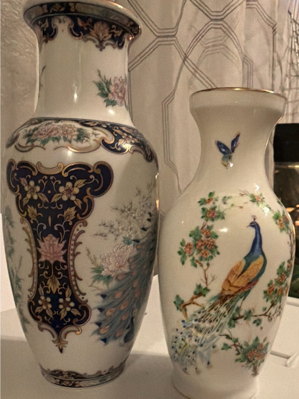 Two Classic White Porcelain Peacock Vases with Floral Accents